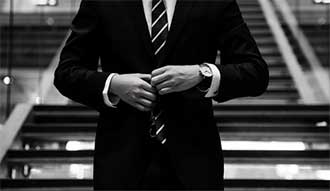 The torso of a man wearing a suit