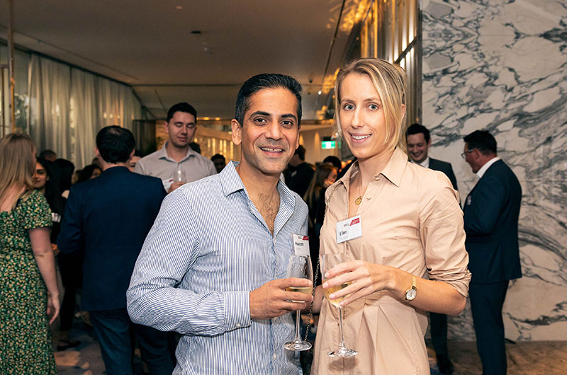 Two people smiling to camera