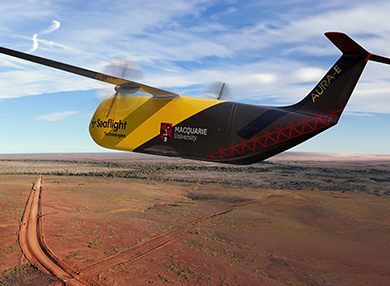 A yellow and black unmanned aerial vehicle flying over a rural landscape.