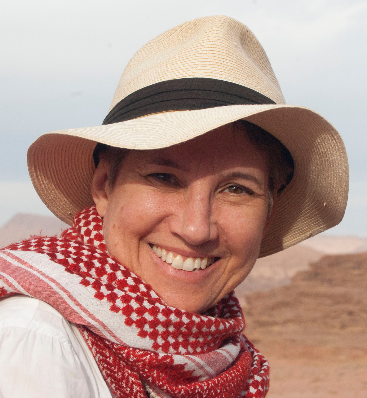 Dr Karin Sowada with desert in background