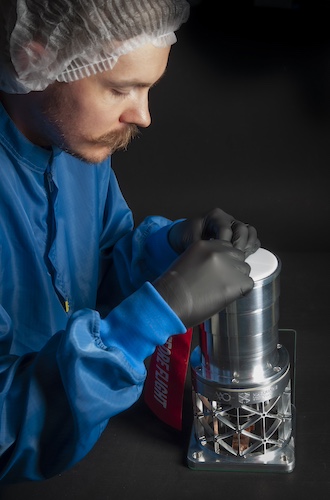 AAO Engineer Yevgen Kripak installs the camera