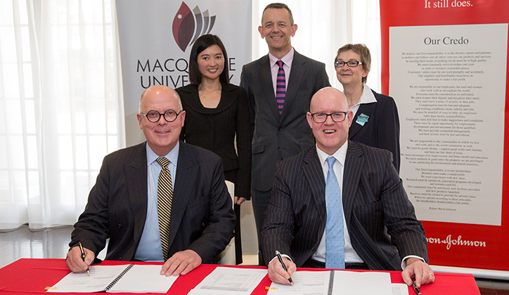  Signing of the partnership agreement. Front: Vice-Chancellor Professor S Bruce Dowton and Managing Director Johnson & Johnson Medical, Gavin Fox-Smith. Back: Director of Health Outcomes and Market Access at Johnson & Johnson Medical, Robyn Chu; Deputy Vice-Chancellor (Corporate Engagement and Advancement) Professor David Wilkinson, and Director Corporate Engagement, Margaret Hudson. Photo: Chris Stacey