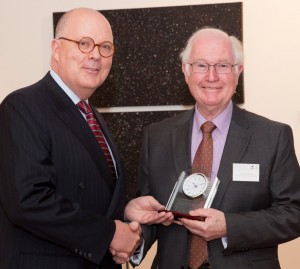 Vice-Chancellor Professor S Bruce Dowton presents Dr Richard Flood with his commemorative timepiece