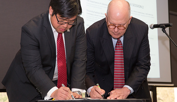  Dr Soutphommasane and Vice-Chancellor Professor S Bruce Dowton signing the supporter agreement
