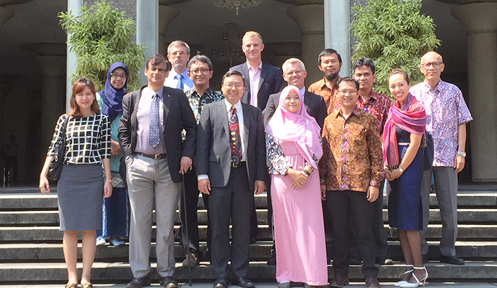  Professor Jim Lee (centre) with senior Gadjah Mada University officials; Professor Naren Chitty; Professor Eryk Dutkiewicz; Dr Lloyd Cox; David Harrison; and Natalie Lee, following the signing of a memorandum of understanding to begin student and staff mobility programs.