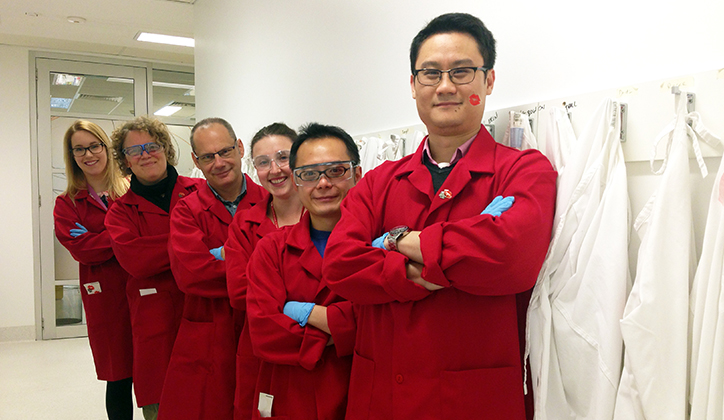  Some of Macquarie's Neurodegenerative Diseases Research Group in their red lab coats (L-R) Kelly Jacobs, Josien De Bie, David Lovejoy, Erin Lynch, Ben Heng and Edwin Lim.