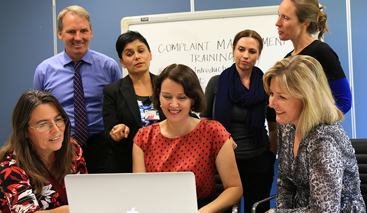  The team reviewing the finished product: [Front] Linda Williamson, Organisation and Staff Development Consultant, Human Resources; Nina Harding, Consultant; Wendy Botha, Organisation and Staff Development Consultant, Human Resources. [Back] Adam Stepcich, Manager Student Discipline and Grievances; Zoe Williams, Head of Governance Services; Kim Carmody, Manager Student Advocacy and Support and Rachael Brady, Human Resources.